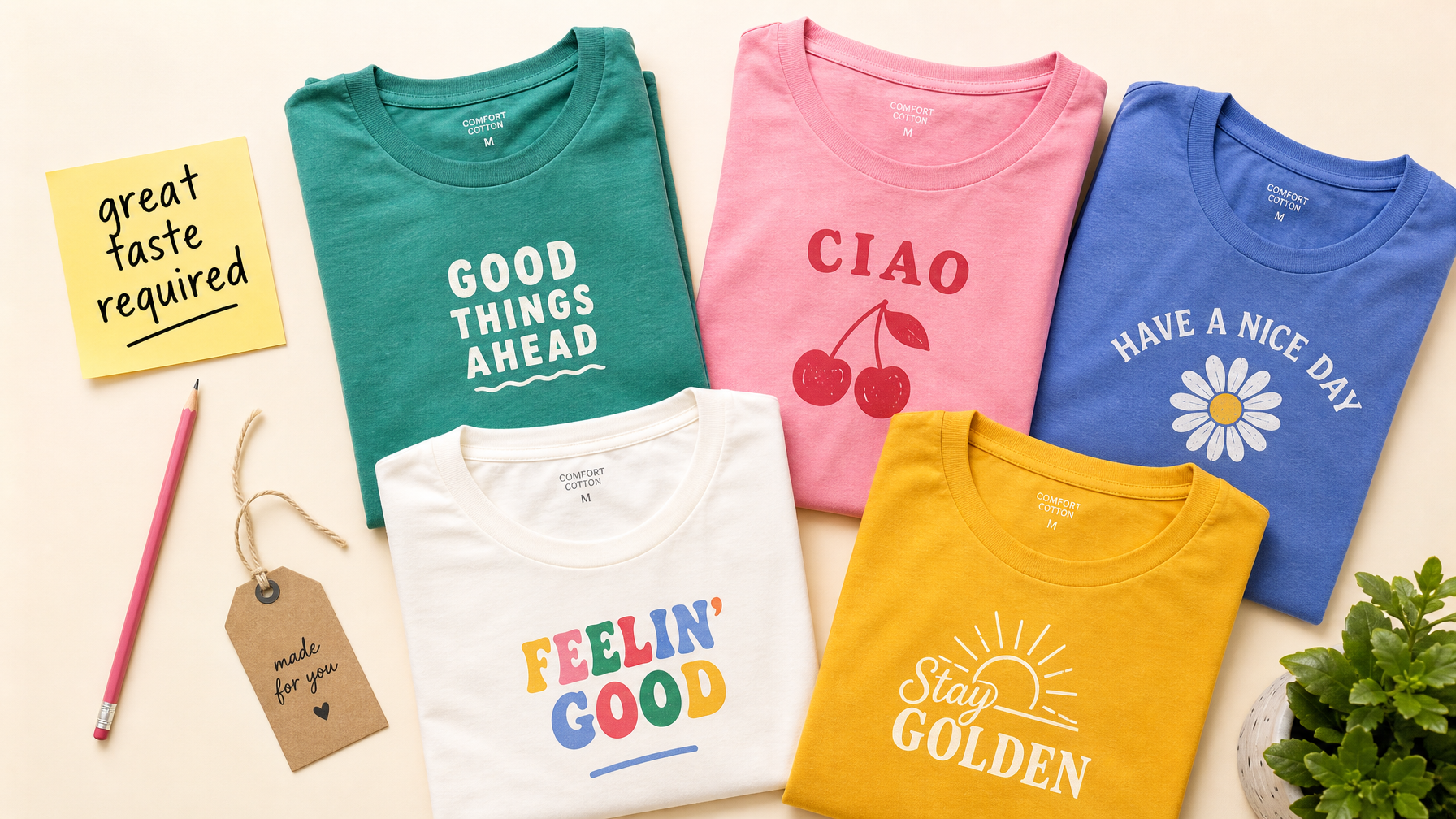 Colorful folded t-shirts arranged as a flat lay with a sticky note reading "great taste required"